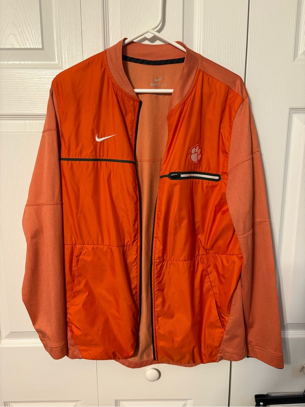 Nike Men’s Orange Lightweight Jacket with Paw Emblem